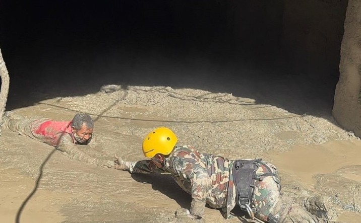 Nepal flood rescue operation in Rasuwa - Army team rescuing survivors from flooded tunnel